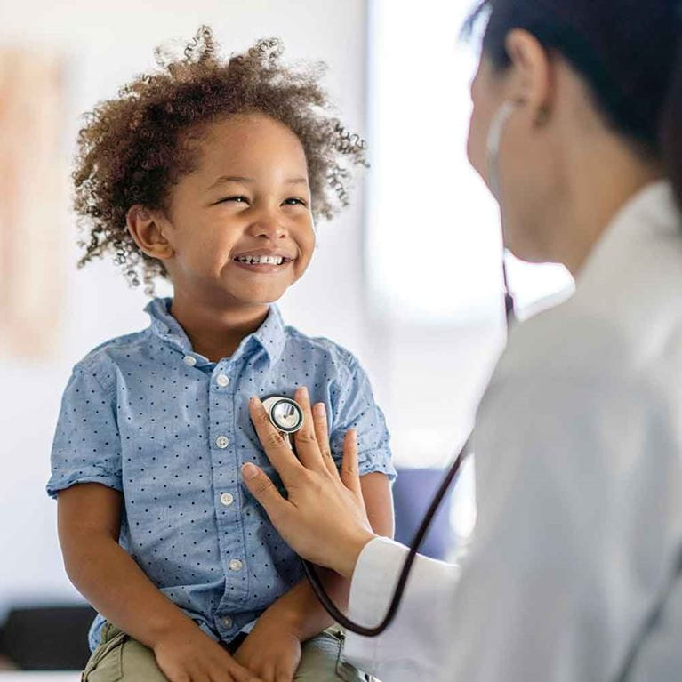  Provider examines young child. 