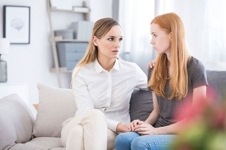 Mom and daughter having a serious conversation