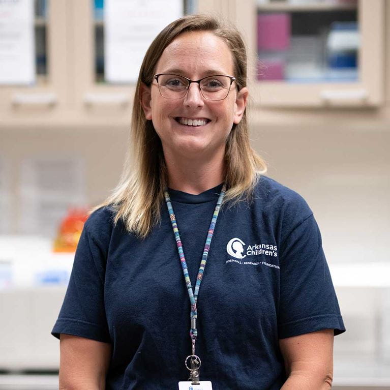 Smiling ACH employee.
