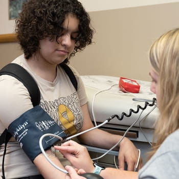 AC Patient, Mackenzie, with clinician.
