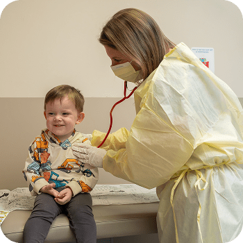 Toddler boy in clinic with doctor.